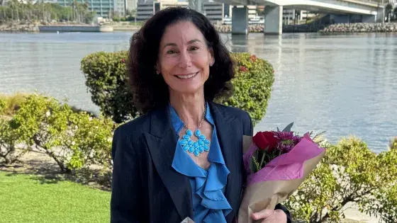 Stacy gets an award for following excellence