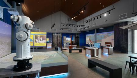 A blue fire hydrant sitting on top of a table. 